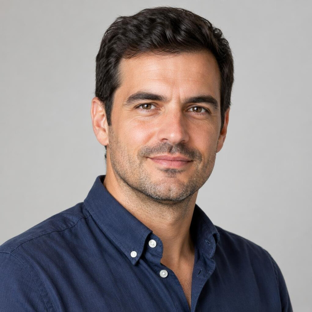 Studio portrait of a Portuguese man with short dark hair