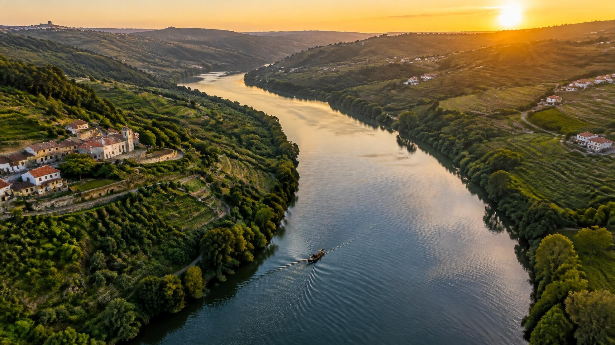 Aerial view of a river winding through green Portuguese countryside