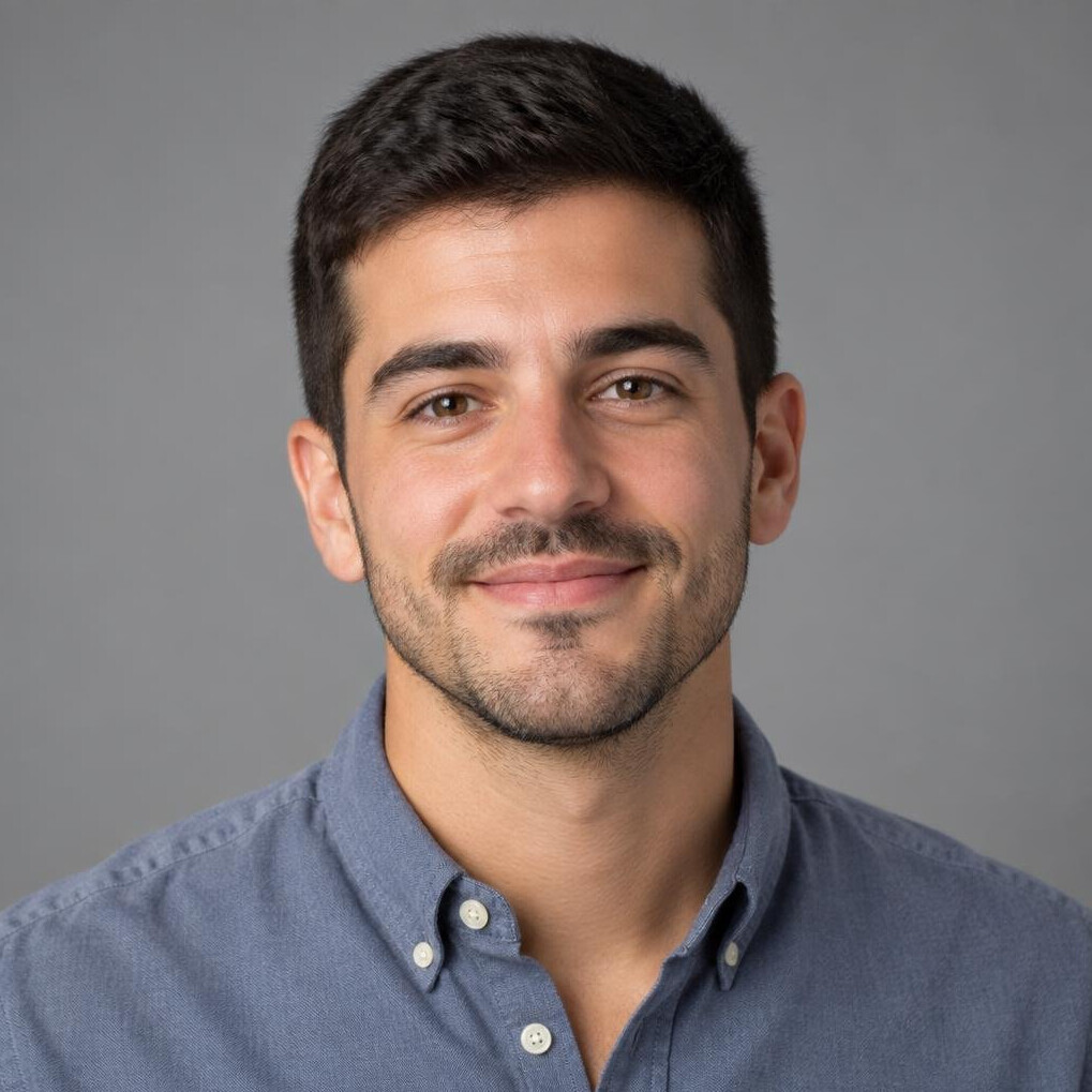 Studio portrait of a young Portuguese man, data journalist